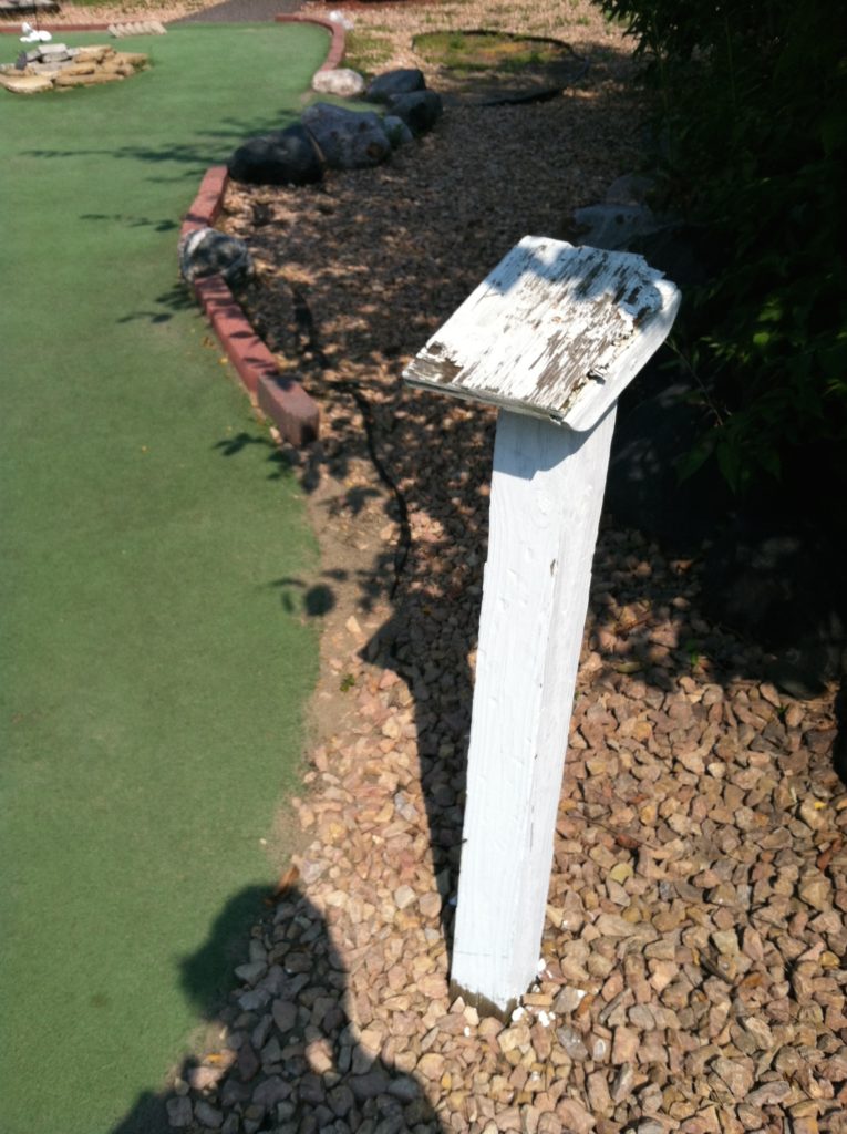 Decaying scorecard stand.