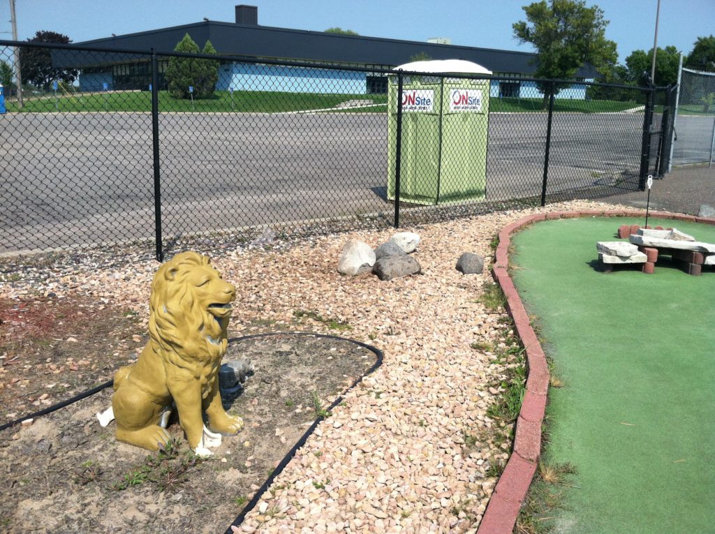 Lion and Port-a-Pot greet you at Hole 18