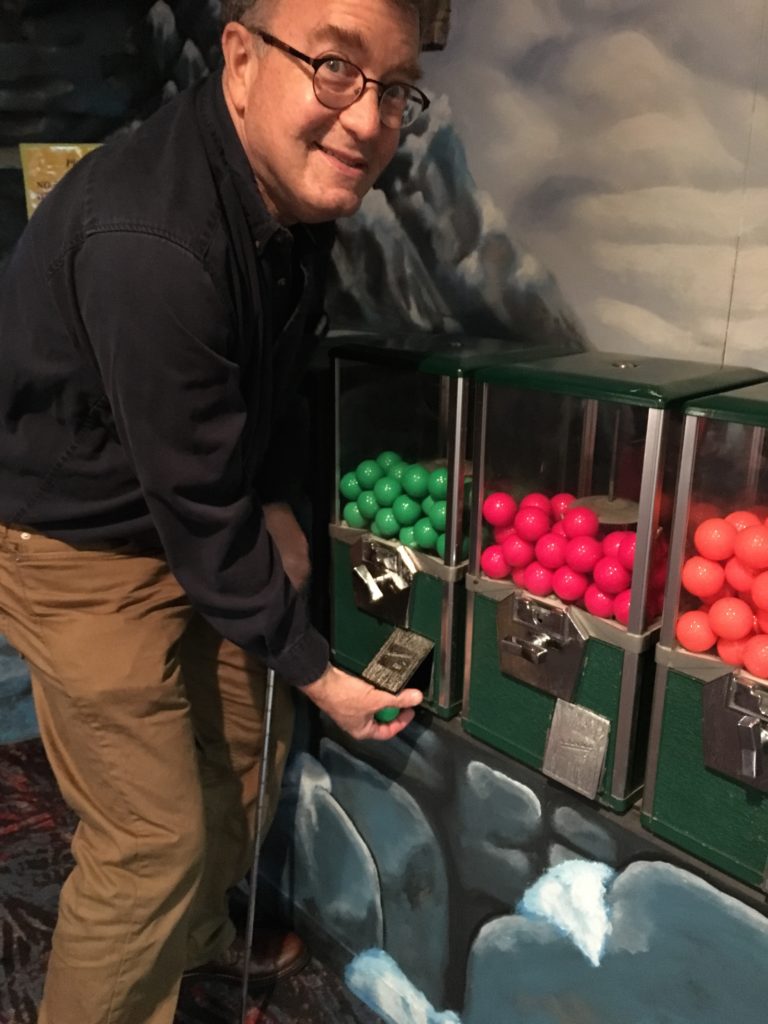 My Dad getting a green ball from these awesome coin-op vending machines.
